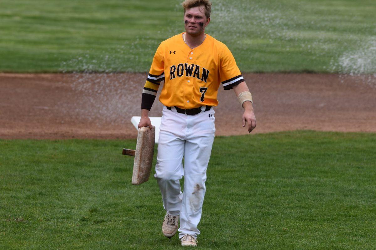 Rowan second baseman Alex Kokos putting away one of the bases after a game this past weekend. Kokos reached his 200th career hit on April 10 in a game against Rutgers-Newark. - Staff Photographer / Nicholas Feldman 