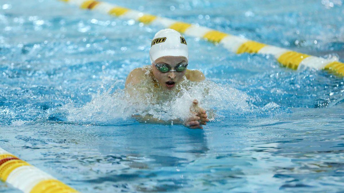 Senior Emily Kopchick performed breaststroke for the Rowan University Swimming and Diving team for four years. Here, she discusses how NCAA DIII athletics' few material motivations curate a culture where all athletes must perform out of passion. - Photo courtesy of Rowan Athletics