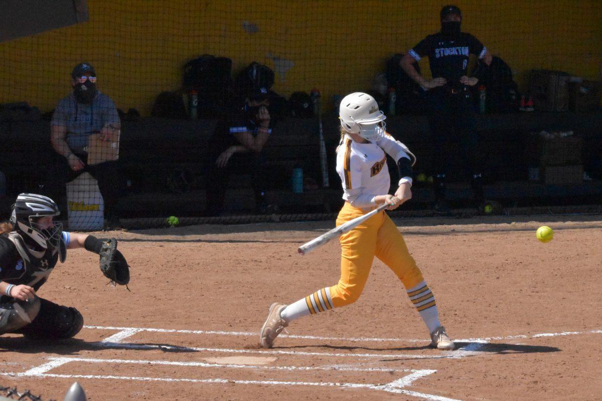 Rowan softball's Morgan Zane swinging at a pitch during their game against Stockton on March 27. Zane recorded her first home run of the season this weekend. - Staff Photographer / Nicholas Feldman