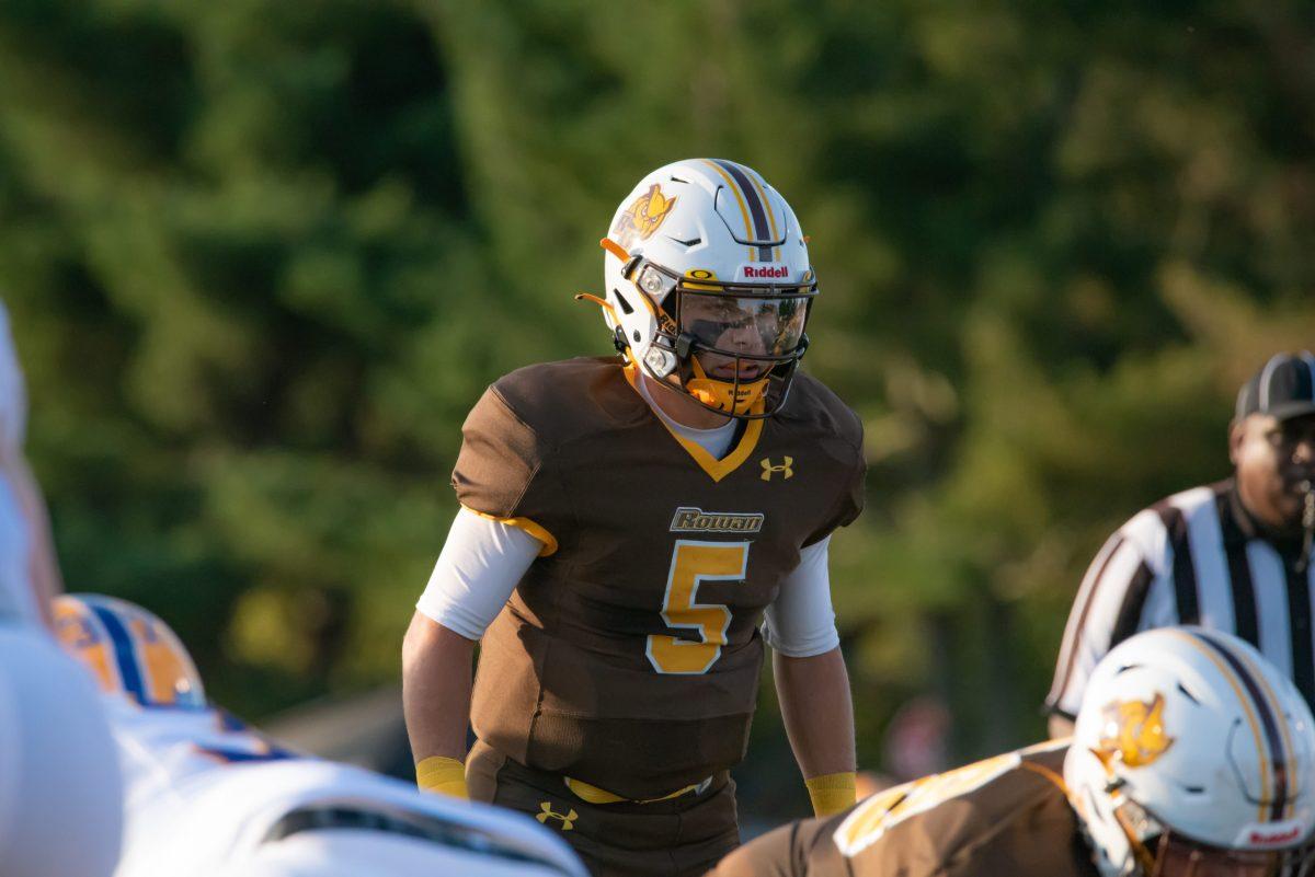 Rowan quarterback Mike Husni before a snap in the game against Widener University. Husni had 83 passing yards, going 10-21 with two touchdowns in the game. Saturday, Sept. 4, 2021. - Multimedia Editor / Nick Feldman 