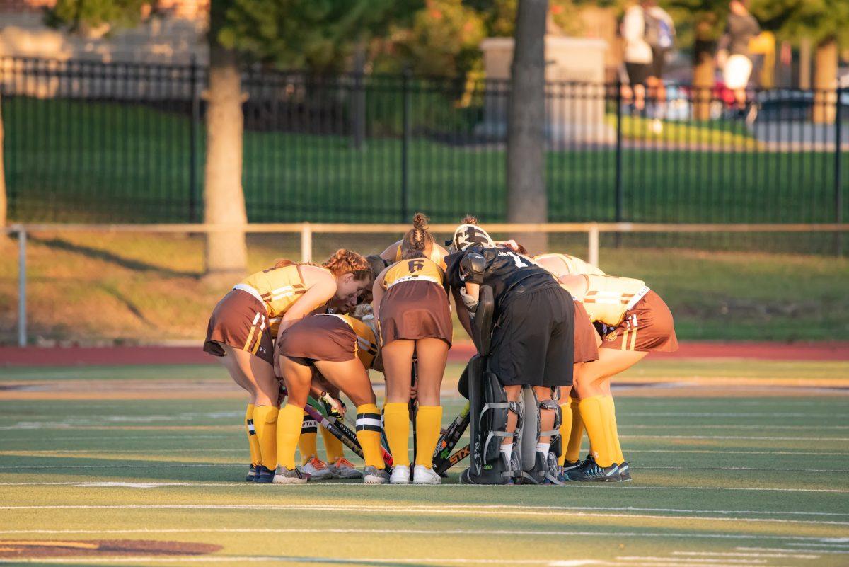 Rowan's field hockey team in a huddle before their game against Ursinus earlier this season. Rowan's team was not able to play their game against Stevens at their originally scheduled time this week. Sept. 3, 2021. - Multimedia Editor / Nick Feldman