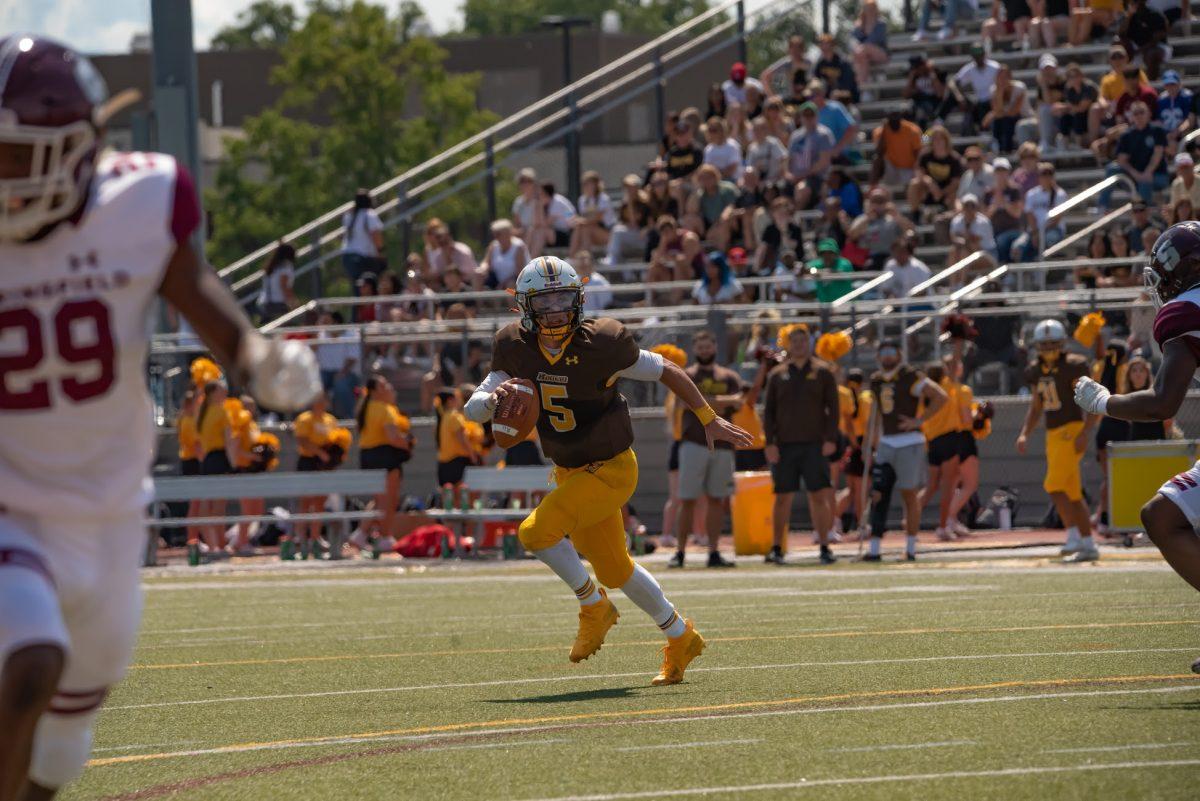 Rowan's quarterback Mike Husni scrabbling during a game earlier this month. Husni looks to lead his time to their first victory. Sept. 11, 2021. - Multimedia Editor / Nick Feldman