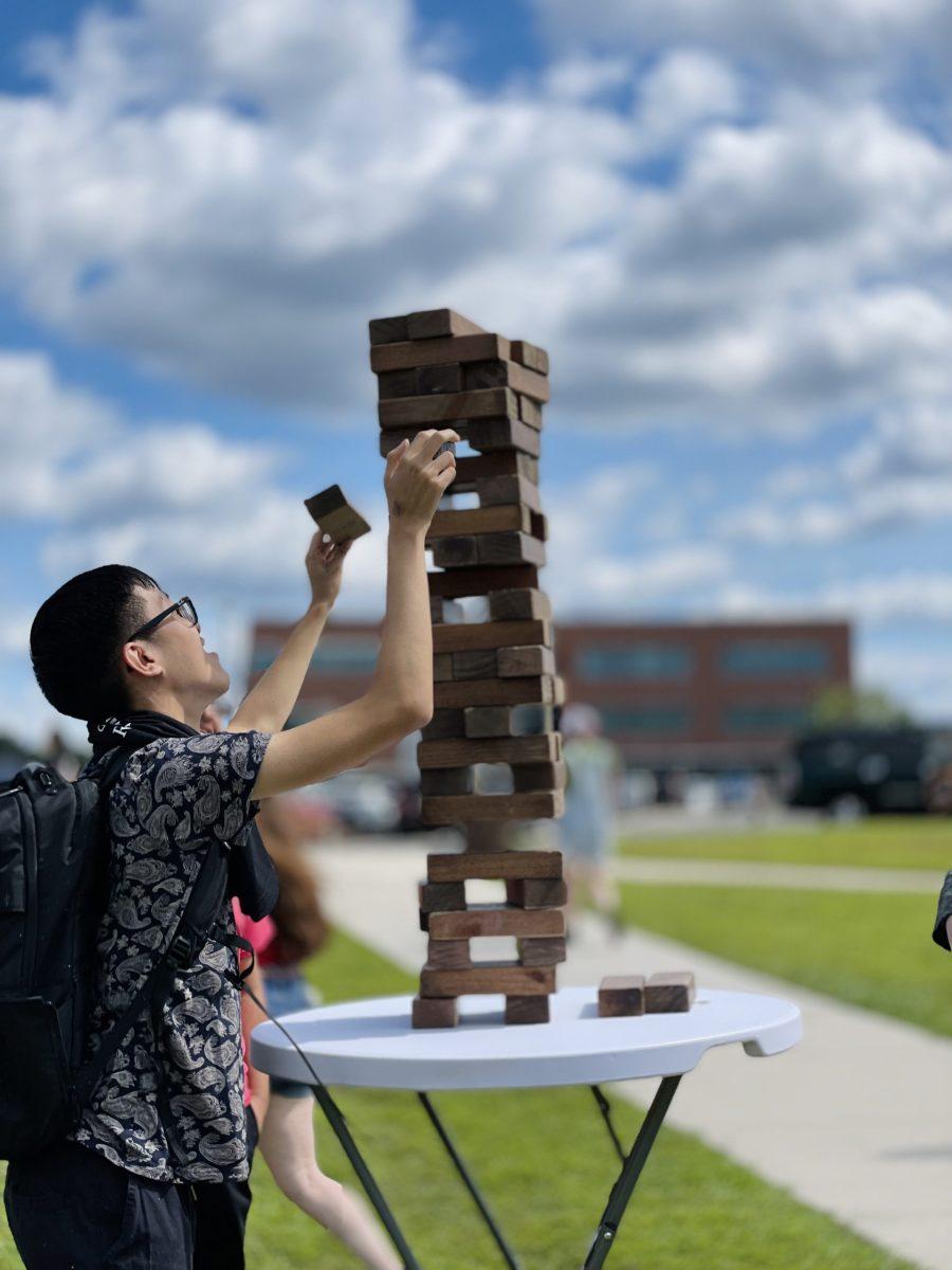 A student enjoying stacking blocks as a part of the many activities at the Rowan Engineering Carnival. - Photo via Arianna Adan