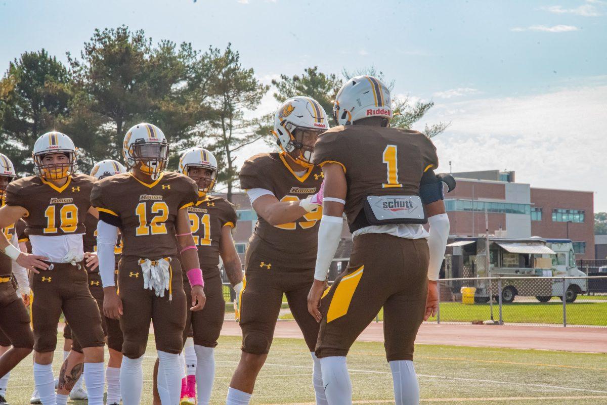 Rowan's Malachi Winters warming up with his team. Winters is one of the seniors on this team. Saturday, Oct. 16, 2021. - Multimedia Editor / Nick Feldman