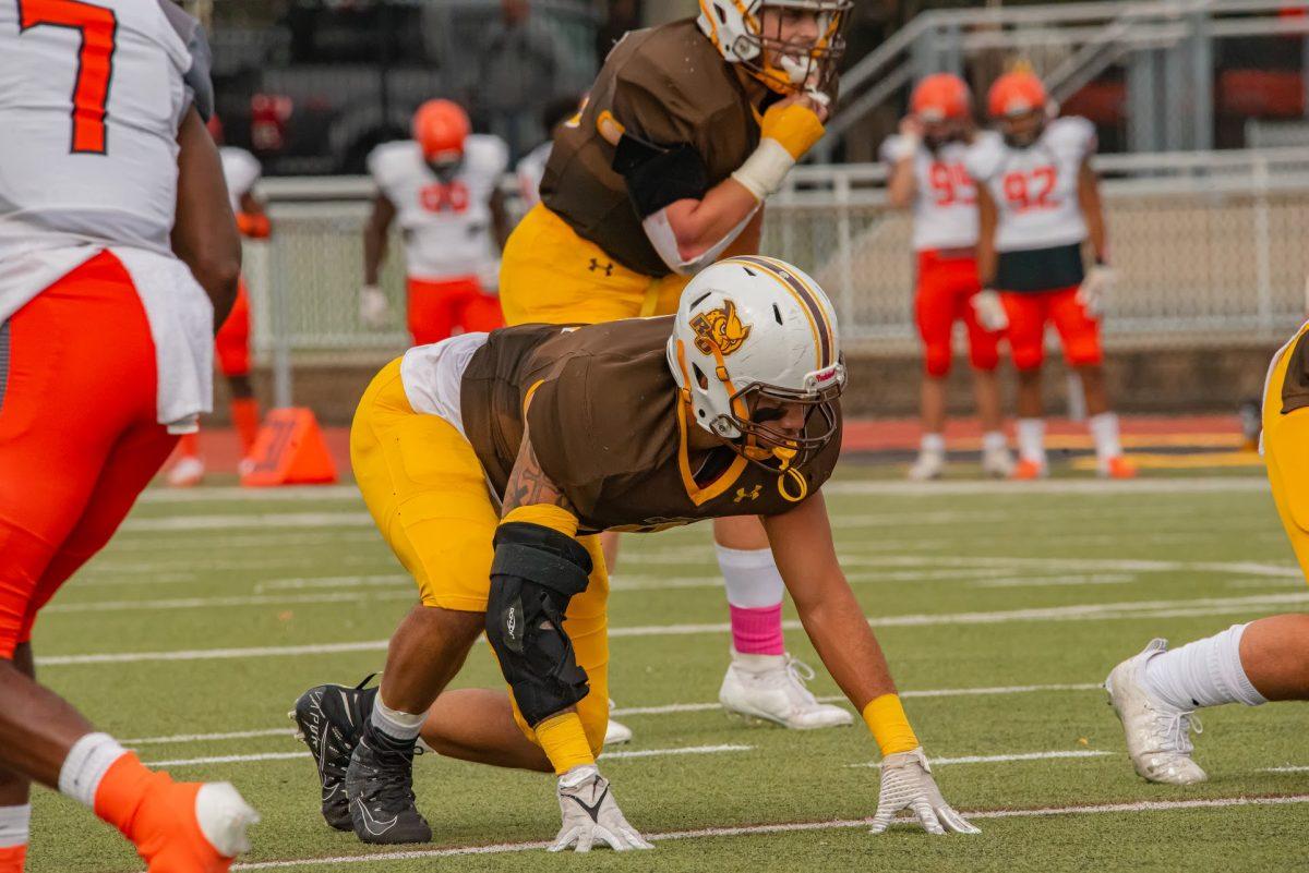 Rowan's AJ Akins lining up before a snap against William Paterson. Akins would record 1.5 sacks in their win last Saturday, bringing his season total to 6.5. Saturday, Oct. 23, 2021. - Multimedia Editor / Nick Feldman