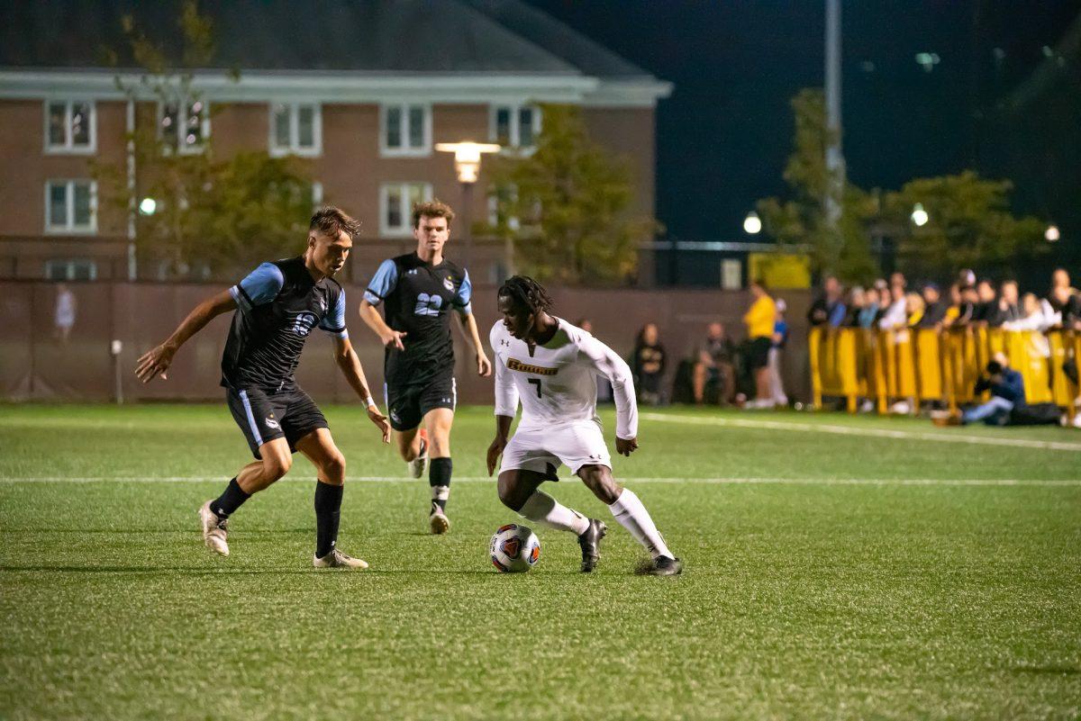 Rowan's Wilby Alfred trying to dribble past defenders in a game earlier this season. Alfred is hoping to help the team pick up their first after two losses. Wednesday, Oct. 13, 2021. - Multimedia Editor / Nick Feldman