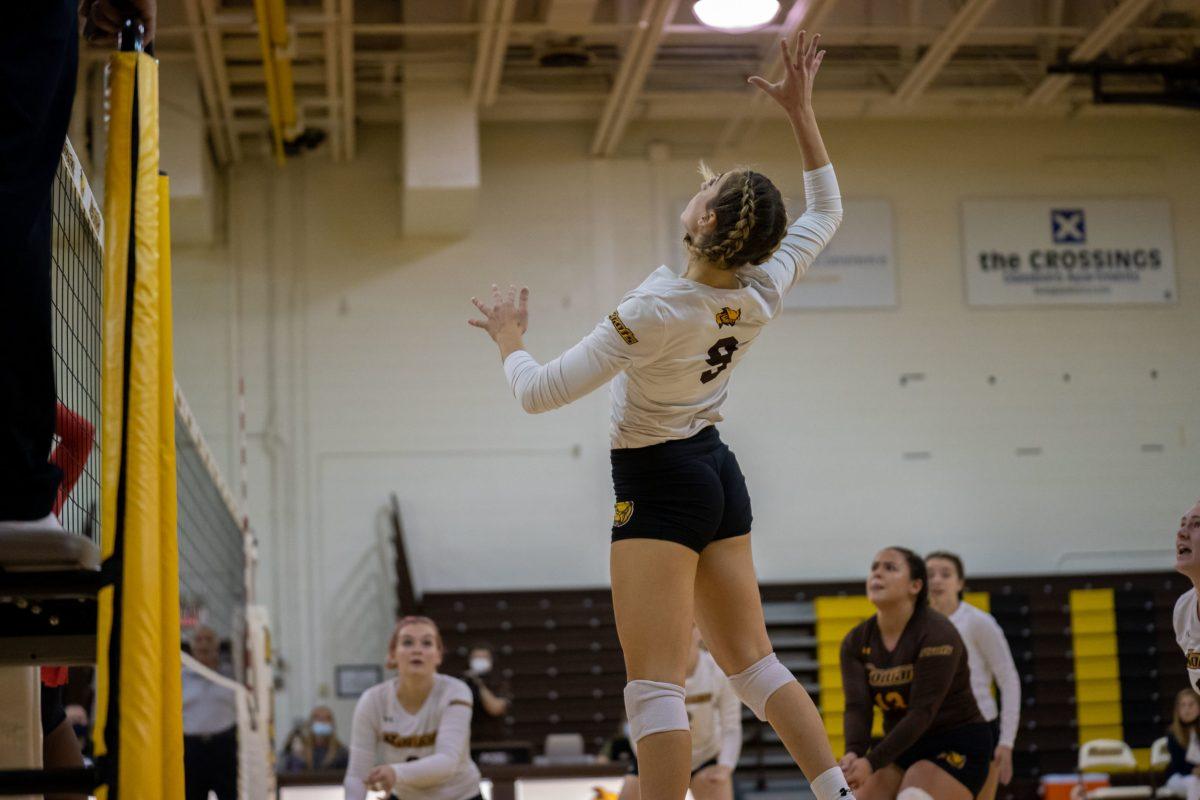 Rowan's Brianna Newson going up to hit the ball during their match against Rutger-Camden. Newson would have 13 kills in that game. Thursday, Oct. 15, 2021. - Staff Photographer / Joey Nicolo 