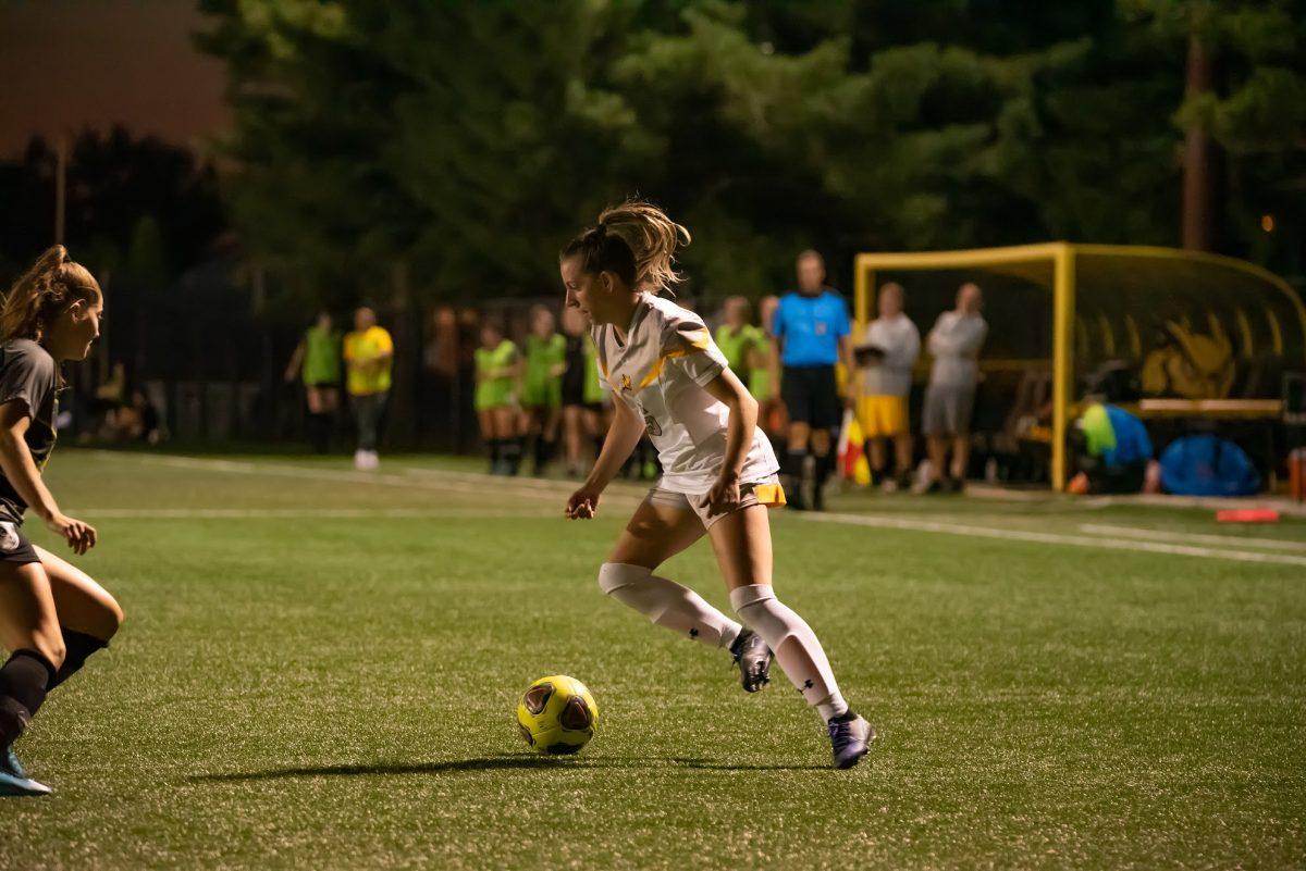 Rowan's Gabby Dean going around a defender in a game earlier this season. In the game against NJCU, Dean scored her first goal of the season. Friday, Sept. 10, 2021. - Multimedia Editor / Nick Feldman