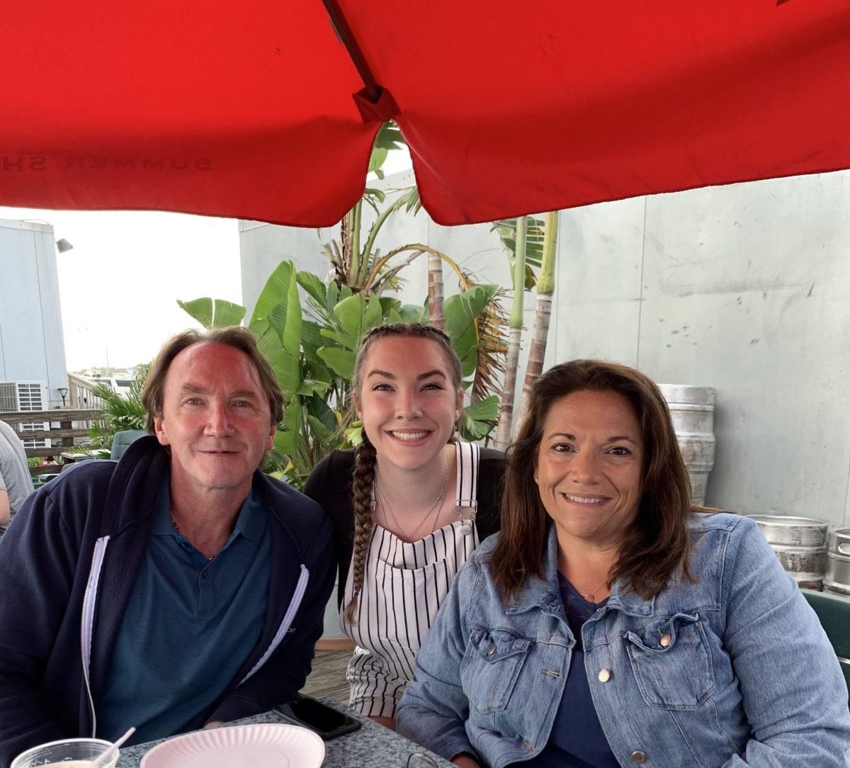 Elizabeth Jasek alongside her mom and dad. This week, senior Elizabeth Jasek discusses homesickness while away at college. - Photo courtesy of Elizabeth Jasek