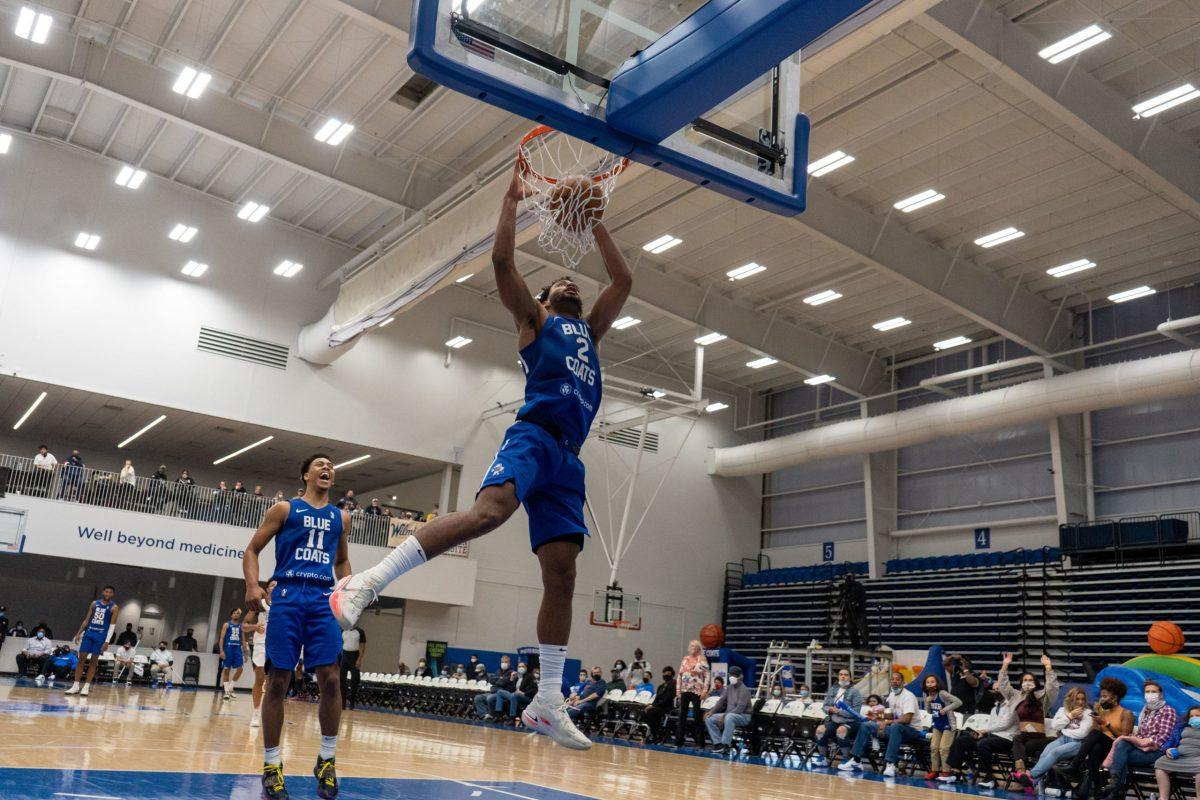 Blue Coats's Braxton Key dunking the ball with Jaden Springer trailing behind him. Key would score eight of his ten points in the second game during the fourth quarter. Sunday, Nov. 28, 2021. - Staff Photographer / Joey Nicolo