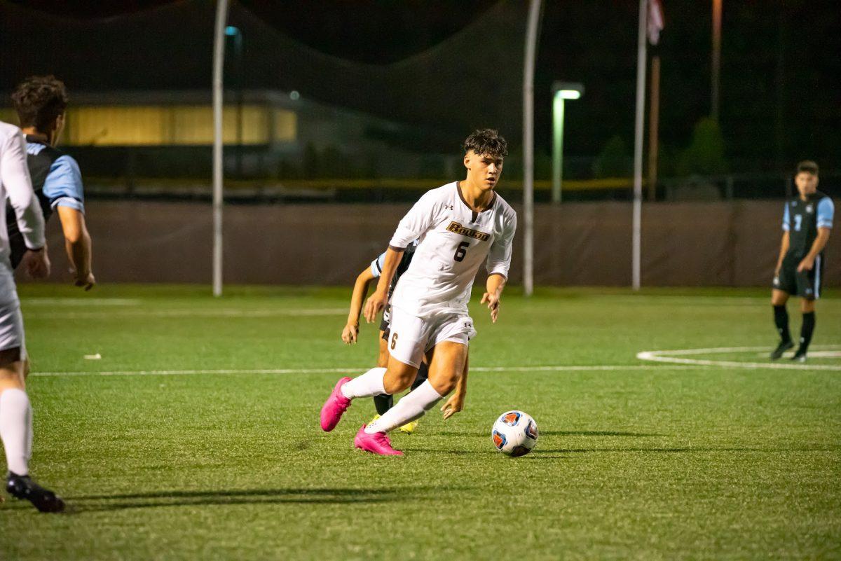 Rowan's Leo Montesinos dribbling up the field earlier this season. Montesinos would score the only goal on Wednesday night in their 1-0 win in the Semifinals game. Wednesday, Oct. 13, 2021. - Multimedia Editor / Nick Feldman