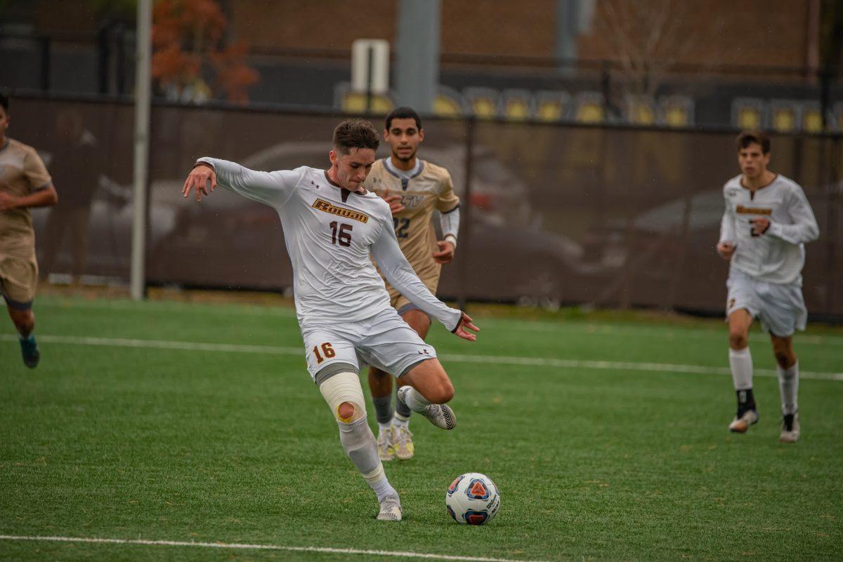 Rowan's Jay Vandermark going to kick the ball during their first round matchup. Vandermark would score the first and game winning goal in Rowan's 2-0 win. Saturday, Nov. 13, 2021. - Multimedia Editor / Nick Feldman