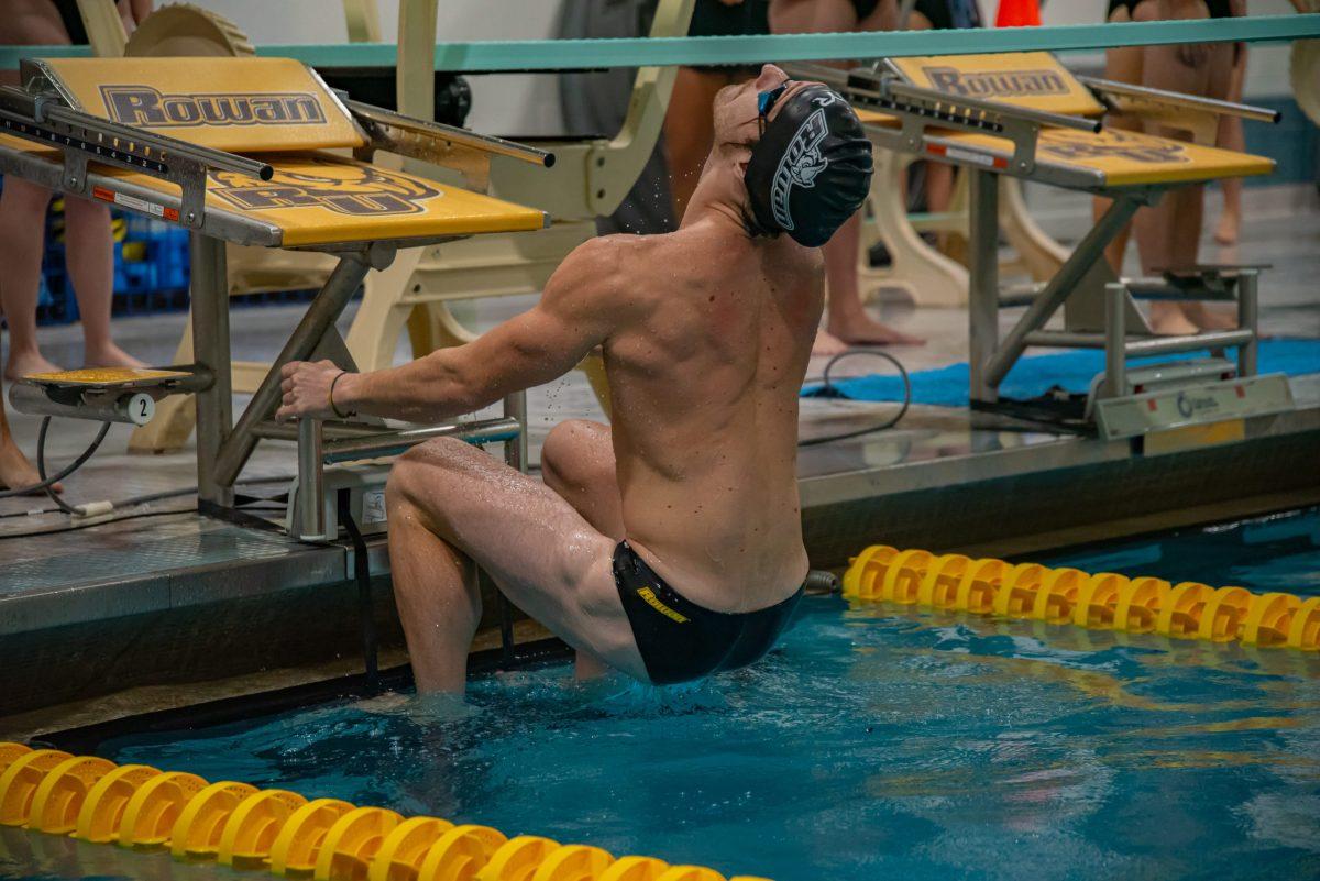 Rowan's James Yates in position to start his backstroke. Rowan swimming & diving would go undefeated this weekend in their two meets. Saturday, Oct. 23, 2021. - Multimedia Editor / Nick Feldman