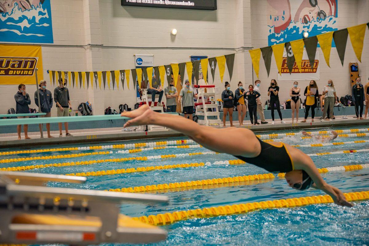 A Rowan swimmer diving into the pool before a meet. This past weekend, Rowan swim would defeat Kean in their first NJAC meet. Saturday, Oct. 23, 2021. - Multimedia Editor / Nick Feldman