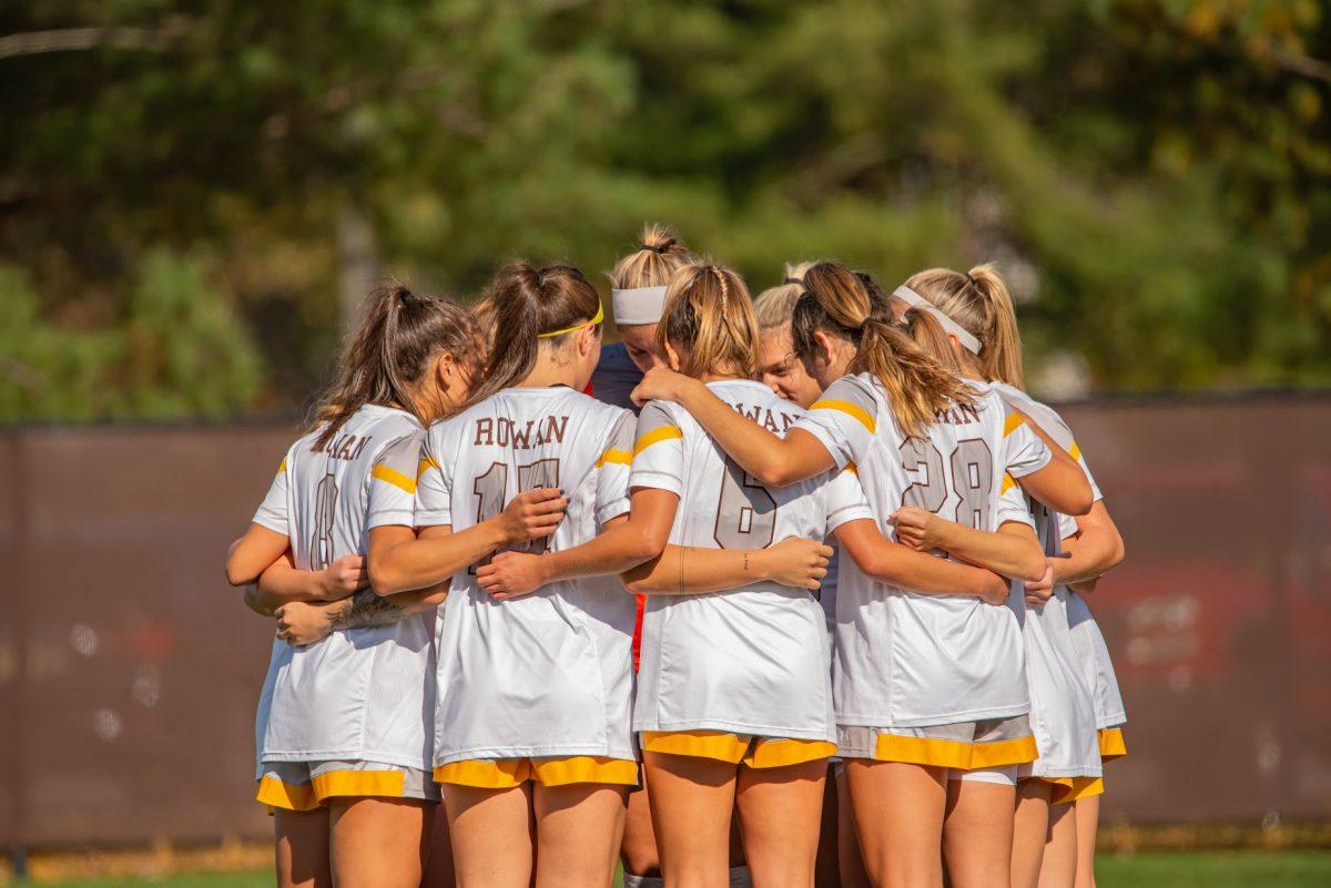 Rowan's women's soccer team in a huddle in an earlier NJAC Playoff game. The team would end their season with a 15-4-1 record. October 30, 2021. - Multimedia Editor / Nick Feldman