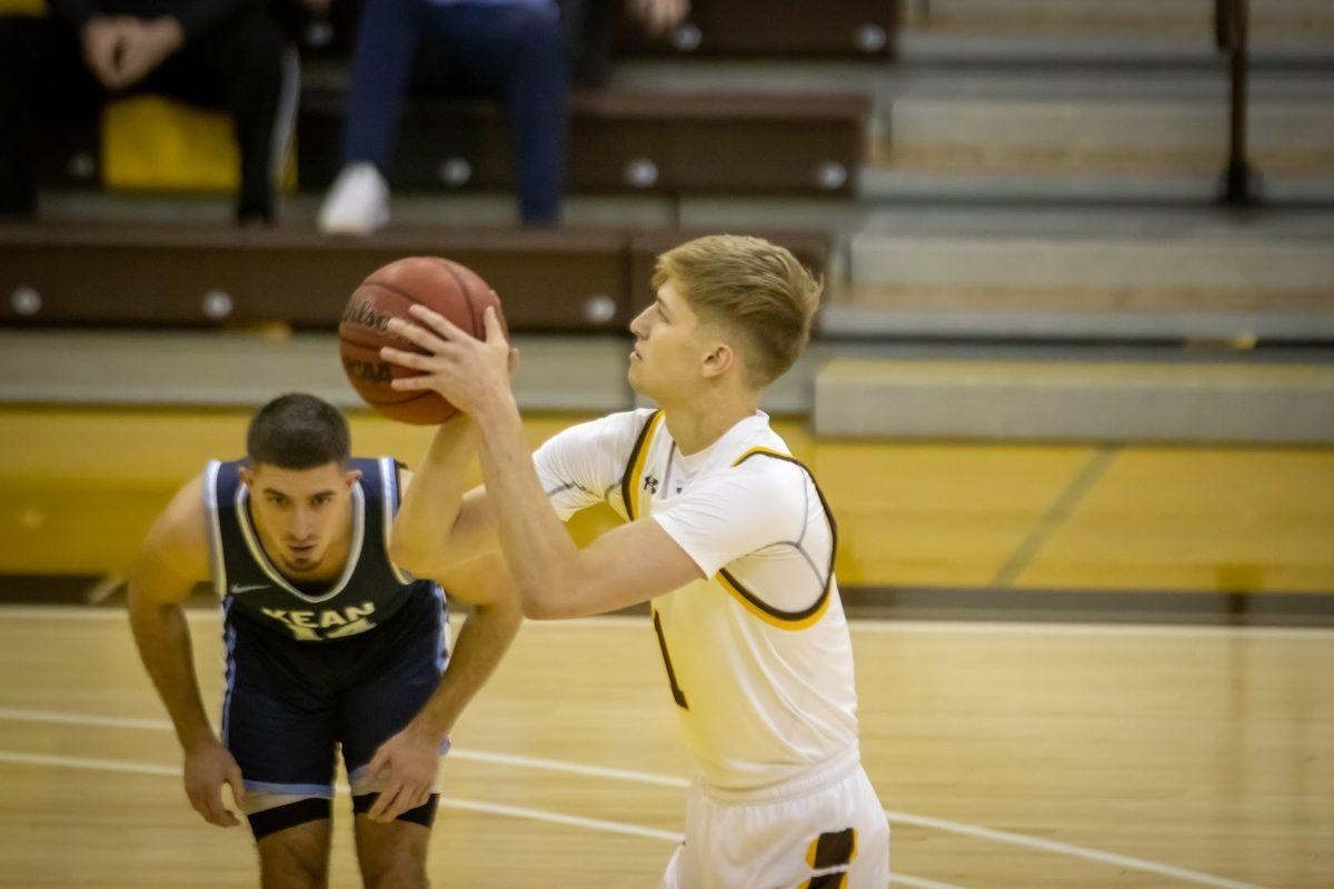 Rowan's Andrew Seager taking a free throw. Seager would total 27 points in Rowan's 99-91 win on Saturday over Kean. Saturday, Dec. 4, 2021. Staff Photographer / Lee Kotzen