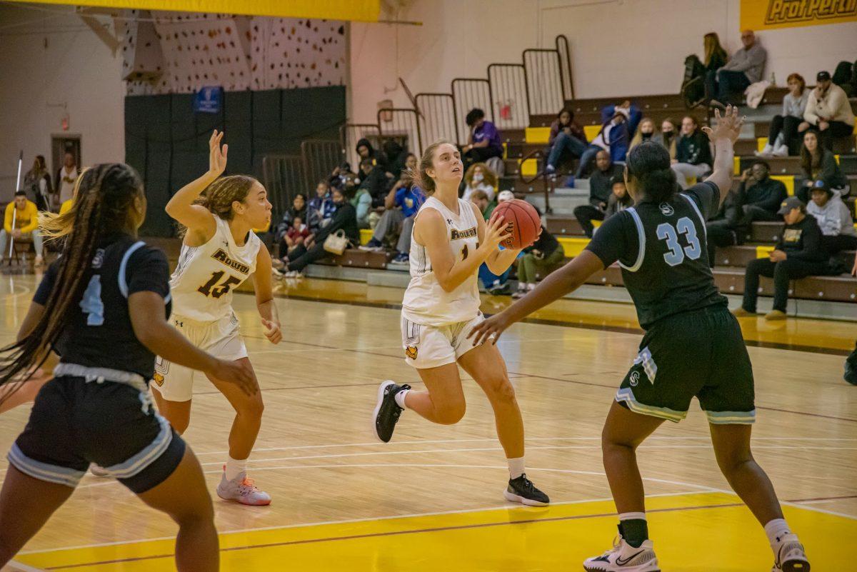 Rowan's Kristina Johnson going to take a floater. In Johnson's first year playing, she has already become a starter for the team. Wednesday, Dec. 1, 2021. - Multimedia Editor / Nick Feldman