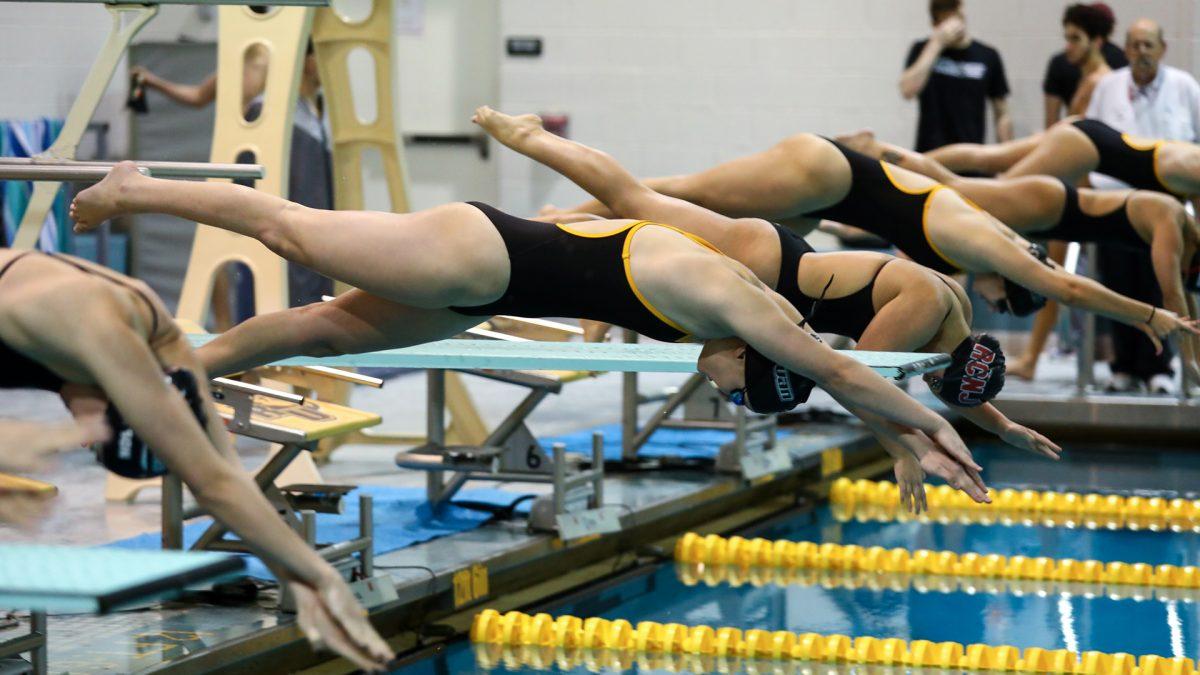 Rowan's Jordan McChesney diving into the pool at the start of an event. McChesney competed in all three days at the WPI Gompei Invitational this past weekend where Rowan finished third. - Photo / Rowan Athletics