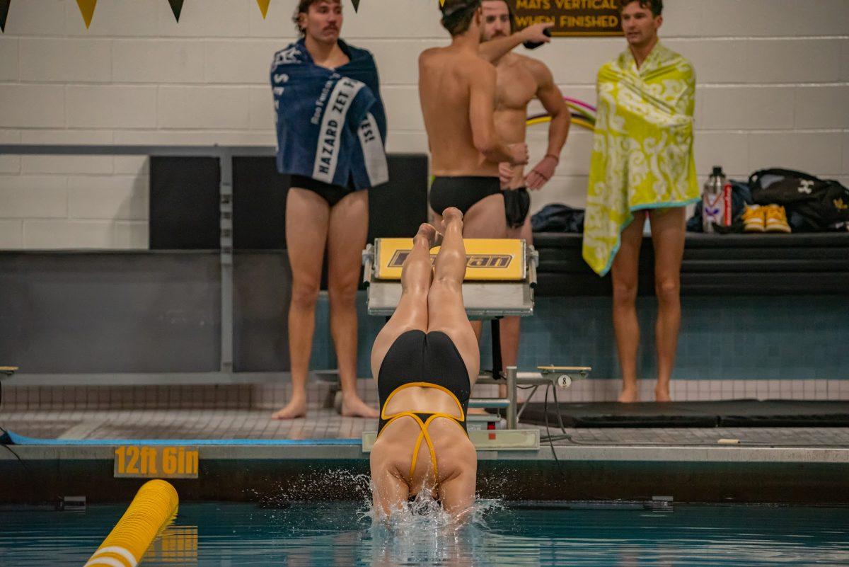 A Rowan swimming diving into the water before a meet. Rowan swim is set to compete once again this weekend. Saturday, Oct. 23, 2021. - Multimedia Editor / Nick Feldman