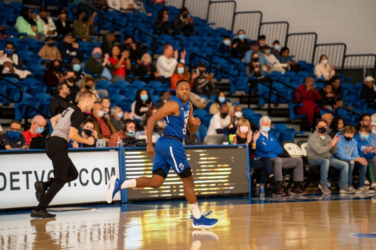 Jared Brownridge running back down the court. Brownridge, while not on the court, now hosts his own podcast. Sunday, Dec. 12, 2021. - Staff Photographer / Joey Nicolo