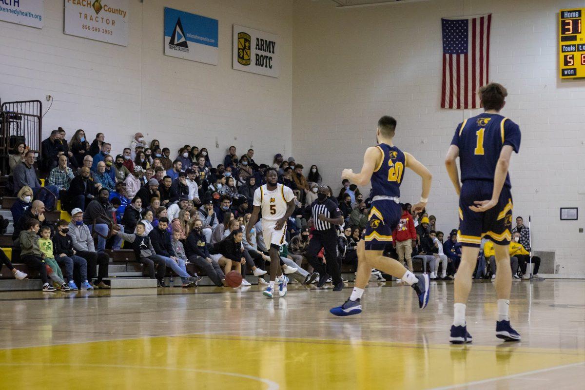 D'Andre Vilmar taking the ball up the court. Vilmar would have a season-high 19 points in their win on Wednesday night over Rutgers-Camden. Wednesday, Jan. 19, 2022. - Multimedia Editor / Lee Kotzen