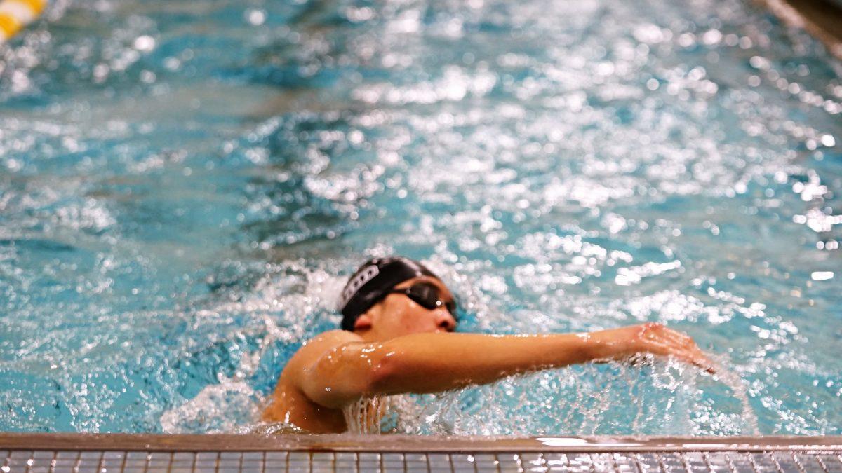 A Rowan men's swimmer during a meet. Rowan men's swimming ended this season undefeated in dual meets. Saturday, Jan. 22, 2022. - Staff Photographer / Ashley Craven  