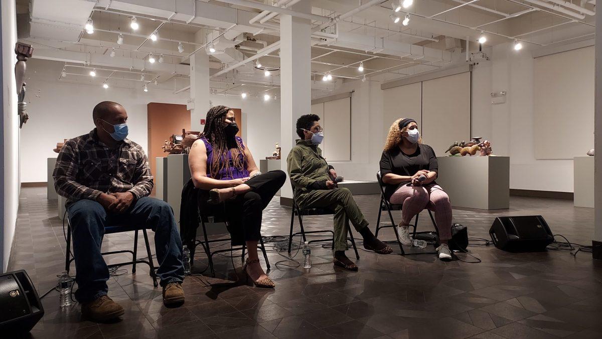 (From left to right) Kyle Smith, Paige Vaccaro, Syd Carpenter, and Sonya Harris discuss the importance of Carpenter's exhibit and Black farmer's in American history during a panel discussion on Tuesday, Feb. 22. - Photo / Chelsea Valcourt