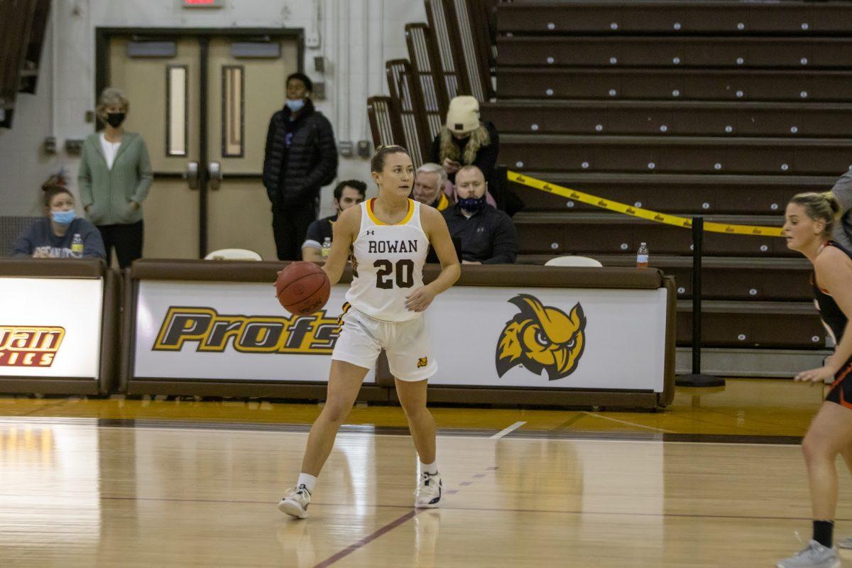 Kate Herlihy controlling the ball at the top of the key. Herlihy would account for ten points in Rowan's Wednesday night win over Rutger-Camden. Monday, Jan. 31, 2022. - Multimedia Editor / Lee Kotzen