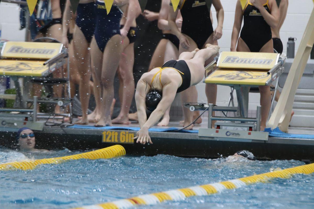 A Rowan women's swimmer starting her swim. The Profs finished third at METS, their last meet of the season. Saturday, Jan. 22, 2022. - Multimedia Editor / Lee Kotzen