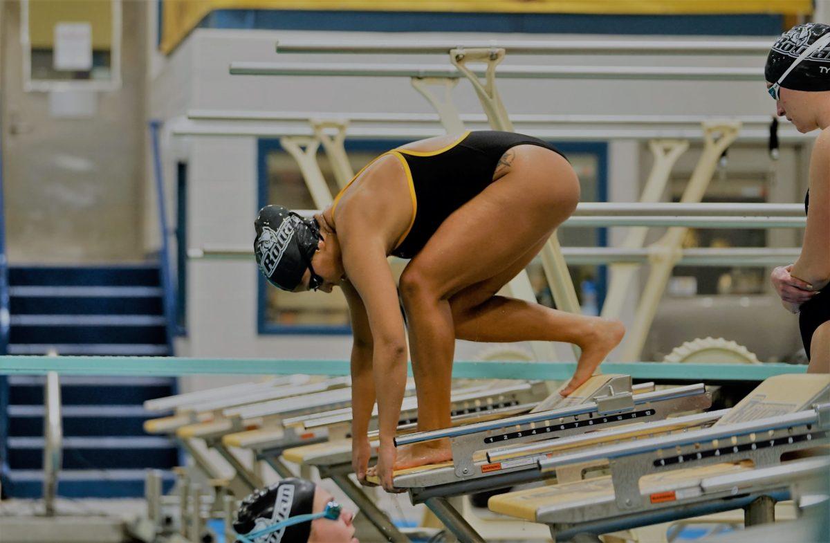 Veronica Alferez setting up to dive into the pool. Alferez has been a key part of Rowan women's swim since 2017. Saturday, Jan. 22, 2022. - Staff Photographer / Ashley Craven