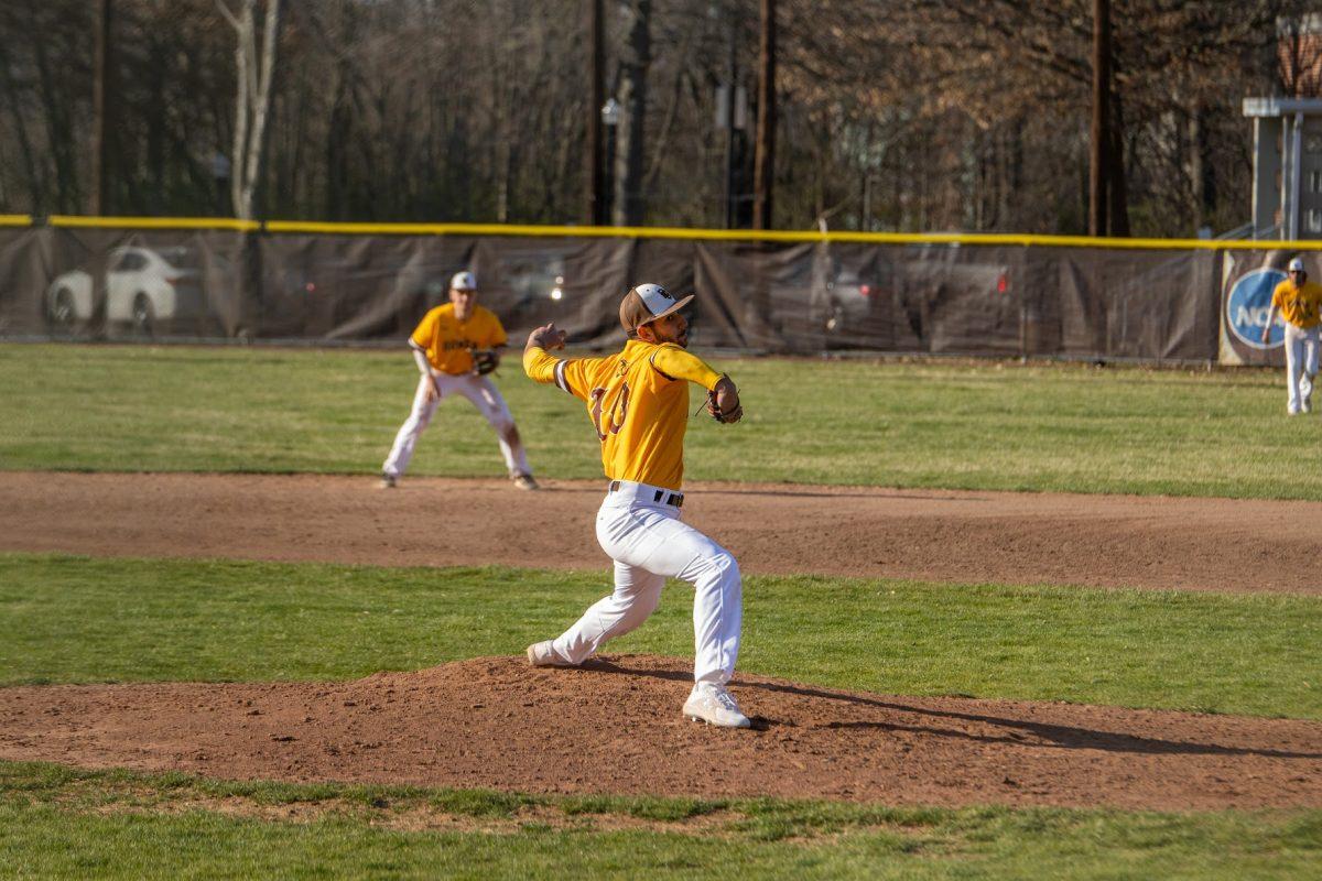 Eli Atiya throwing a pitch against York College. Atiya recorded three strikeouts in the seven innings he pitched on Tuesday afternoon. Tuesday, March 22, 2022. - Multimedia Editor / Lee Kotzen