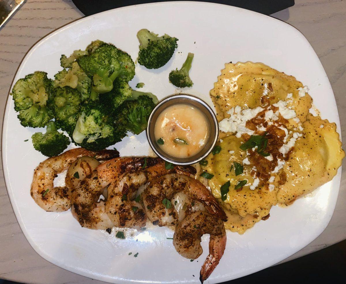 Co-Editor-in-Chief Joel Vazquez shares his experience at Bonefish Grill in Deptford, NJ. This is main course dish: a shrimp and scallop platter with pumpkin ravioli and broccoli. - Photo by Joel Vazquez-Juarbe