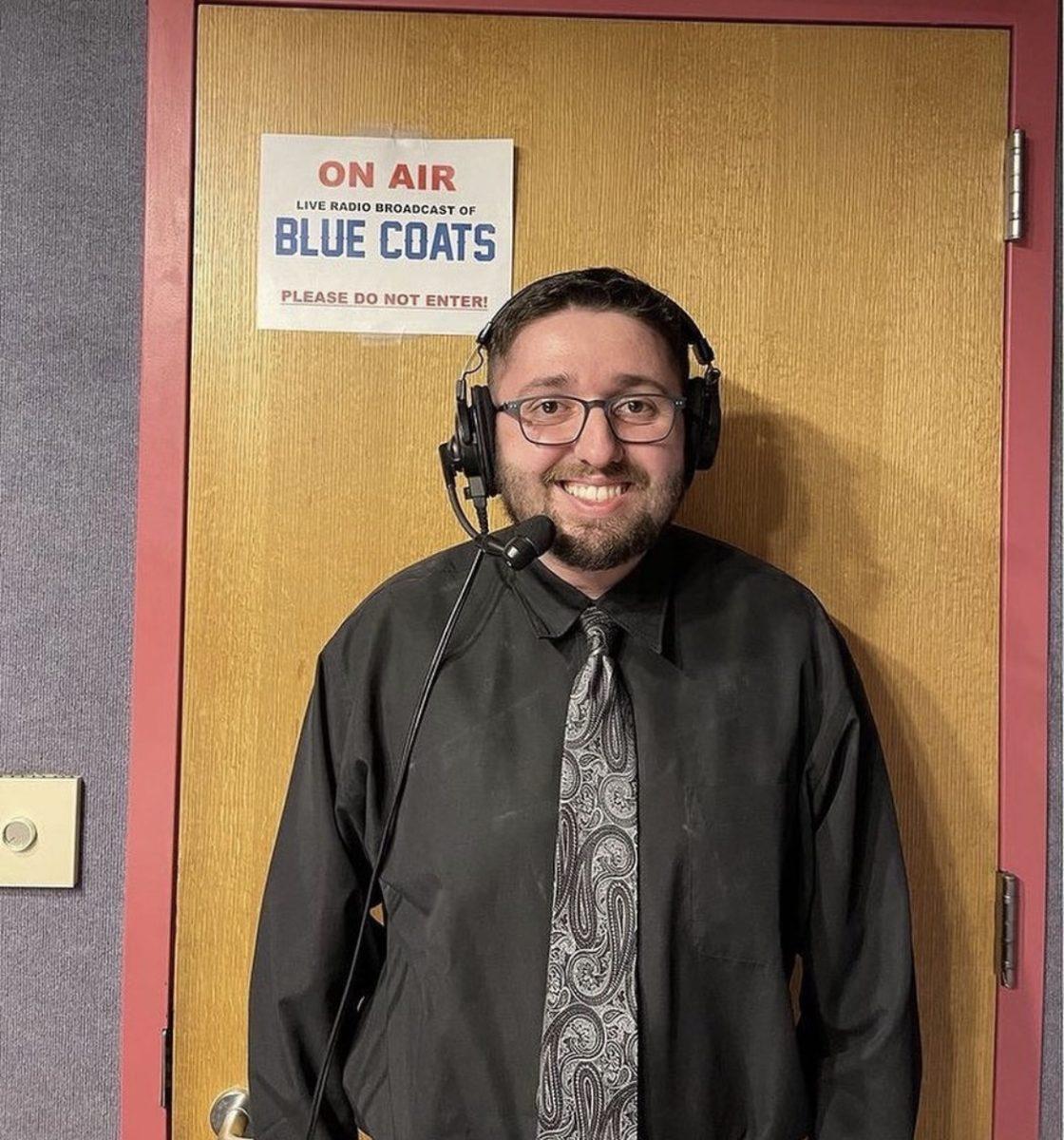 Sports Communication and Media major, Jason Joseph, poses in the WGLS conference room before calling a game for the Delaware Blue Coats. The Blue Coats and Rowan University partnered to give students pursuing careers in the sports industry an opportunity to work for the team. - Photo / Jason Joseph