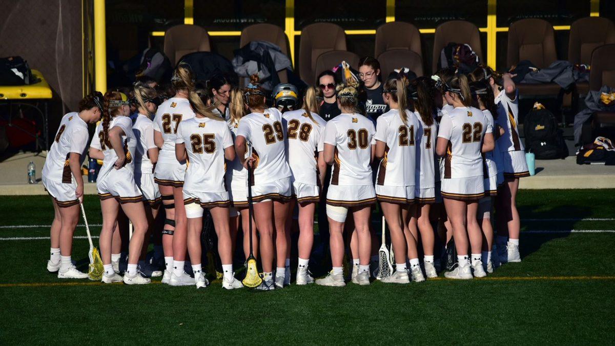 Rowan's women's lacrosse team in a huddle. The team picked up their first loss of the season this past Monday. - Photo / Nick Feldman via. Rowan Athletics
