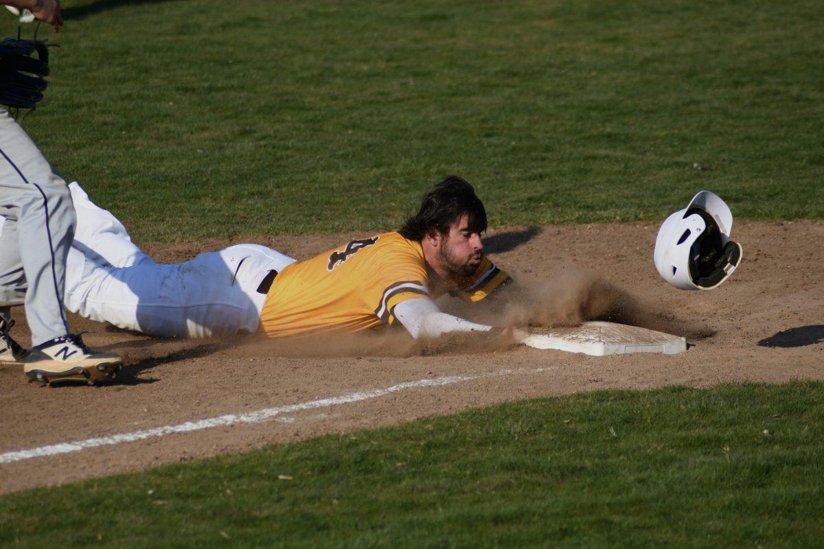 Ryan Murphy sliding back to first base earlier this season. Murphy was recently named NJAC Player of the Week. Wednesday, March 30, 2022. - Staff Photographer / Tyrese Williams