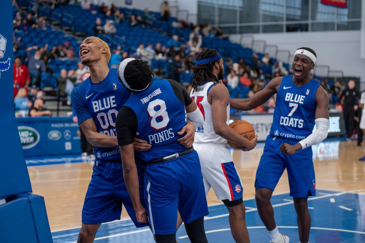 (From left to right) Patrick McCaw, Shamorie Ponds, and Karim Mane celebrating during their game against the Motor City Cruise. The Blue Coats now head towards the playoffs with the fifth best record in the league. Sunday, March 27, 2022. - Staff Photographer / Joey Nicolo