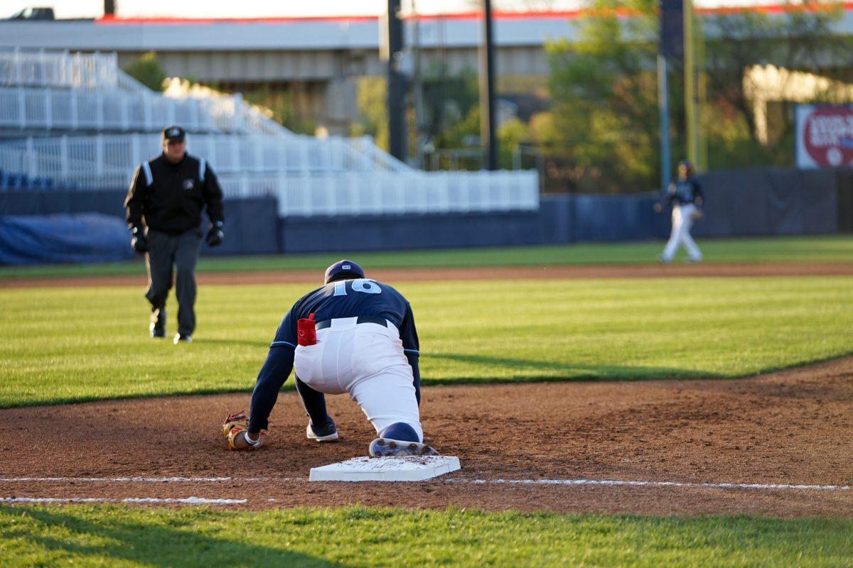 Omar Meregildo stretching to make the catch. Meregildo struck out three times in the last game of the series. Wednesday, April 20, 2022. - Staff Photographer / Ashley Craven 