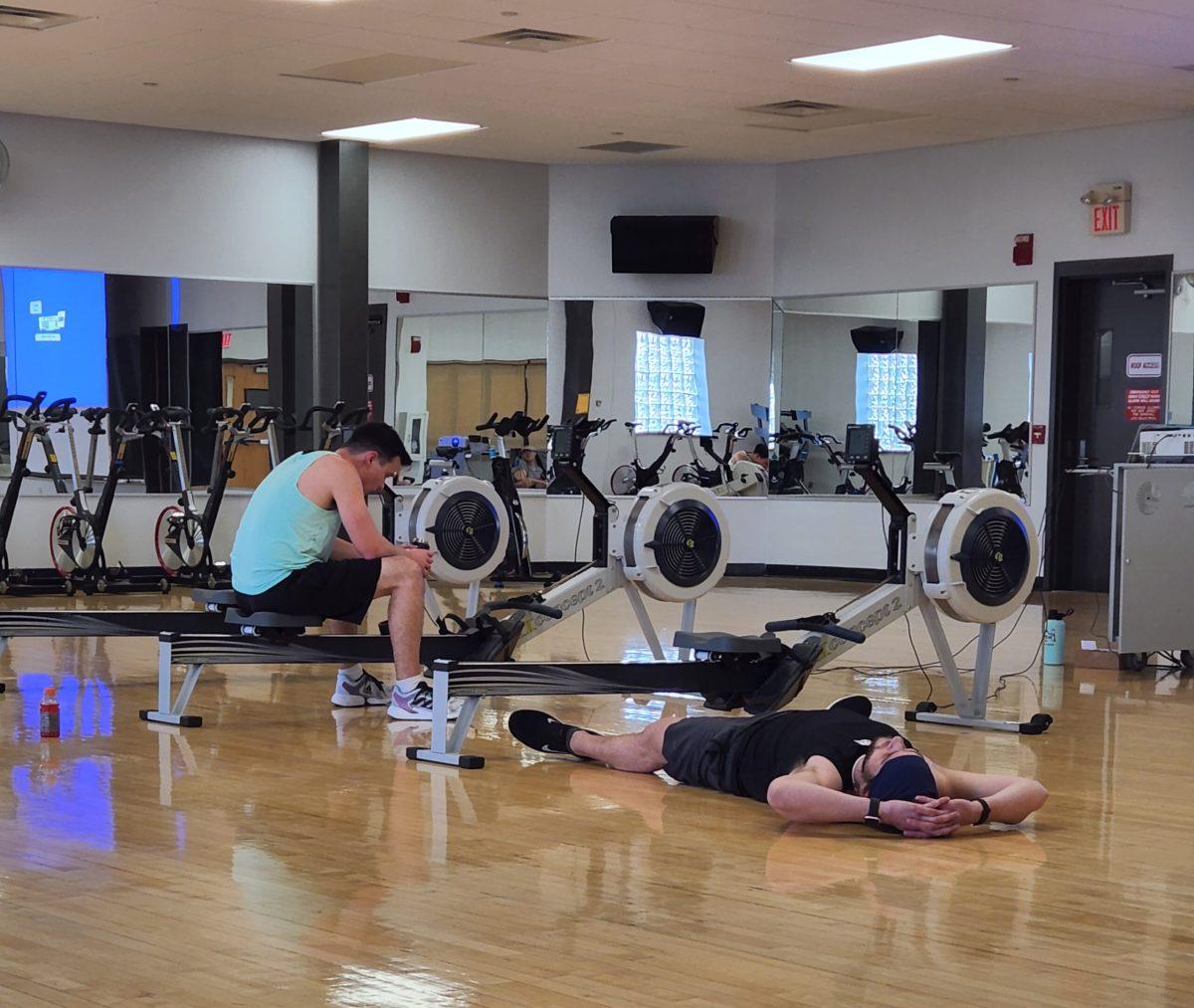 Crew Club members Jordan Callahan and Daniel Pakrad after their 2k erg race. Pakrad not only won the race, but had the best overall time of the event. - Photo / Berry Andres