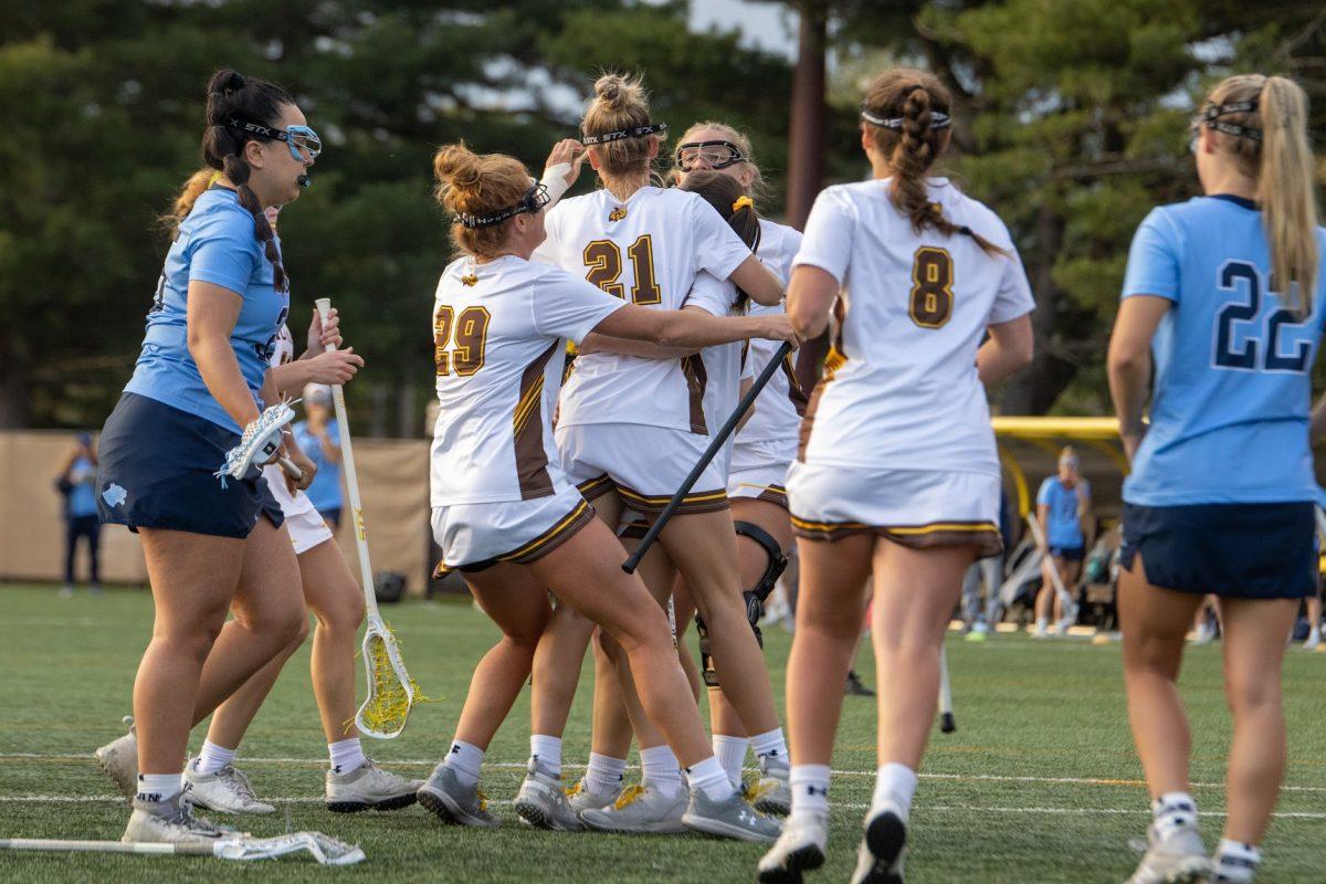 Lacrosse celebrating after a goal. The team scores 21 goals in their victory against Kean. Saturday, April 23. - Multimedia Editor / Lee Kotzen