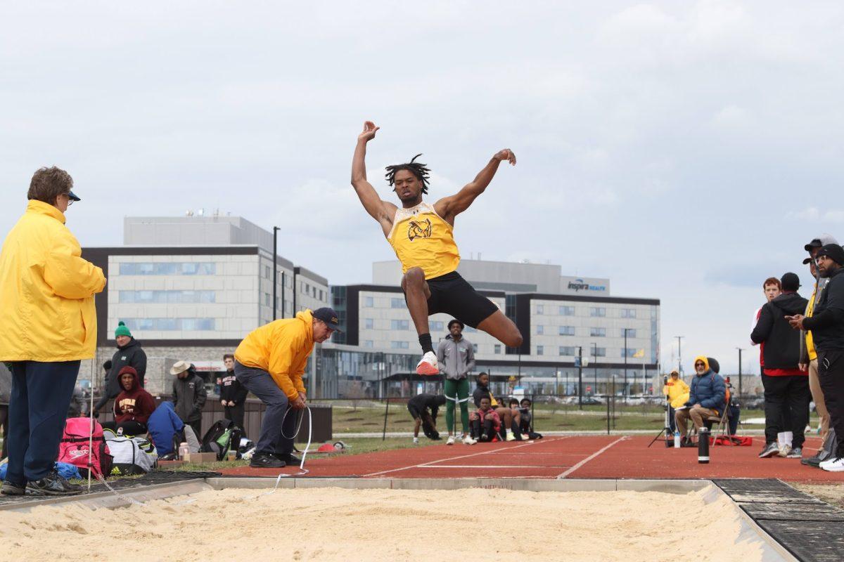 Ahmir Johnson during a long jump attempt. Johnson set the Division III record this past weekend. Saturday, March 26, 2022. - Multimedia Editor / Lee Kotzen 