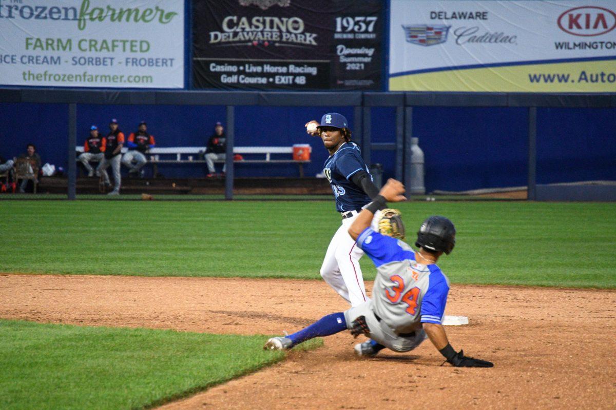 Jordy Barley makes a throw to first to complete a double play. Barley recorded a throwing error that would lead to a run in the Blue Rocks 5-4 loss to the IronBirds. Friday, May 27, 2022. - Staff Photographer / Tyrese Williams