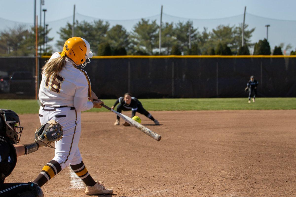 Cat Thomas making contact with the ball. Thomas drove in all three runs in their playoff victory. Wednesday, April 20, 2022. - Multimedia Editor / Lee Kotzen