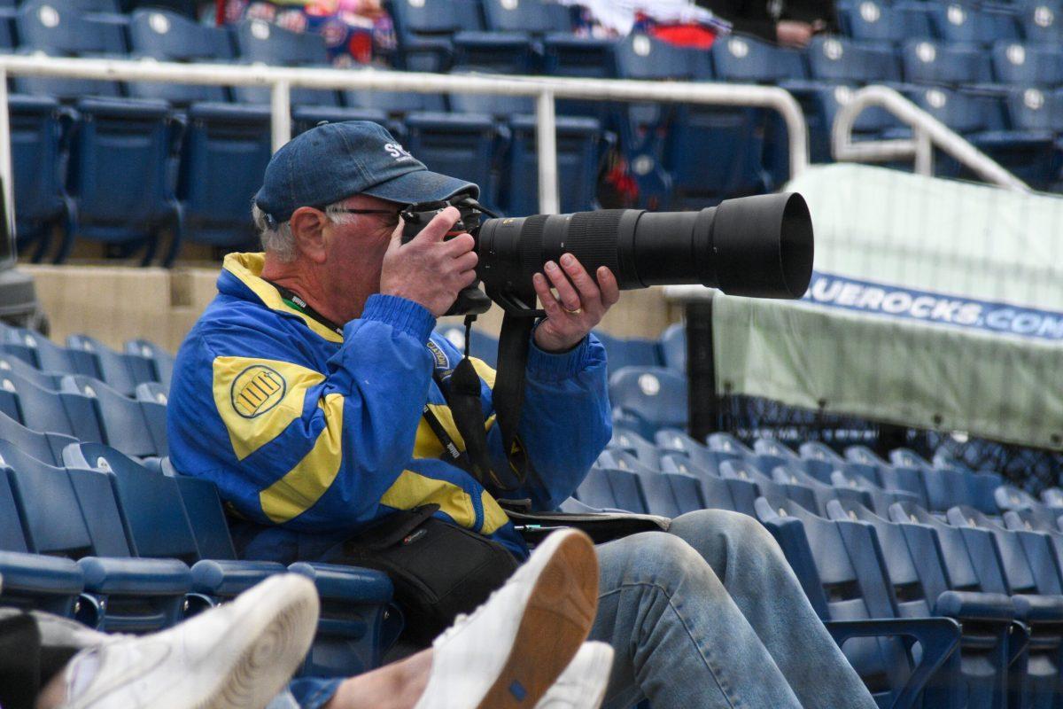 Team photographer Brad Glazier takes a photo of the team early in the season. Friday, May 8, 2022. - Staff Photographer / Tyrese Williams.