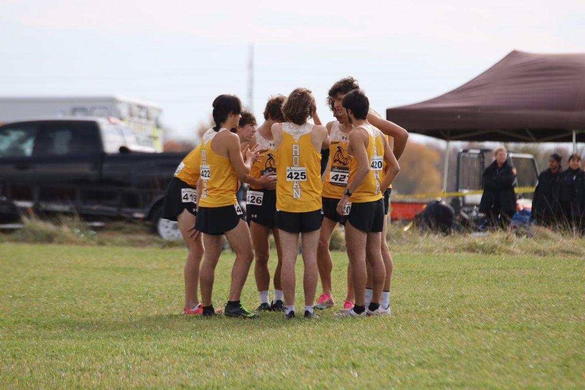 Rowan men's cross country team stands in a huddle. The team finished fourth overall in their regional championships meet. Saturday, Nov. 13, 2021. - Multimedia Editor / Lee Kotzen