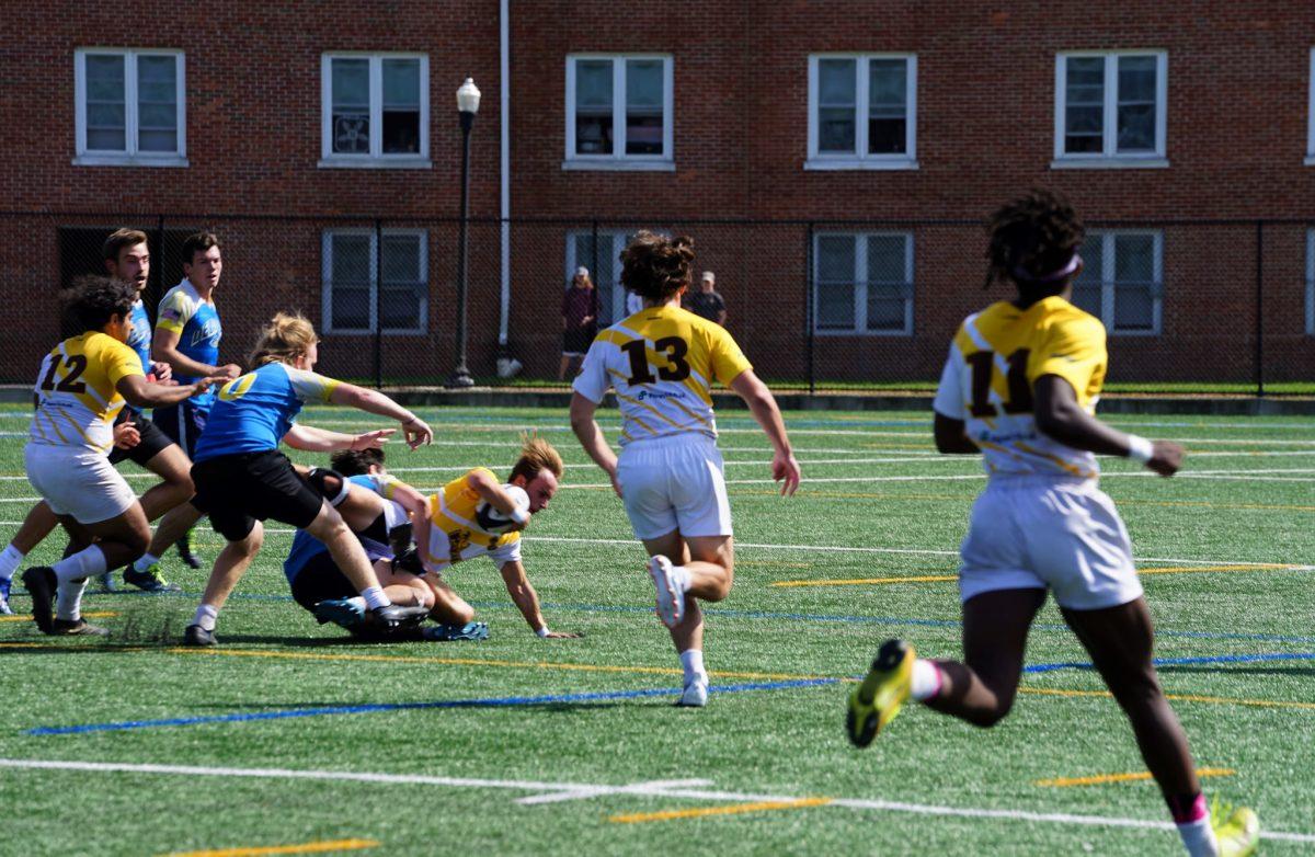 Rowan rugby player gets brought down during a play. Rowan rugby faced Villanova in a scrimmage on Saturday afternoon. Saturday, Oct. 1, 2021. - Staff Photographer / Ashley Craven