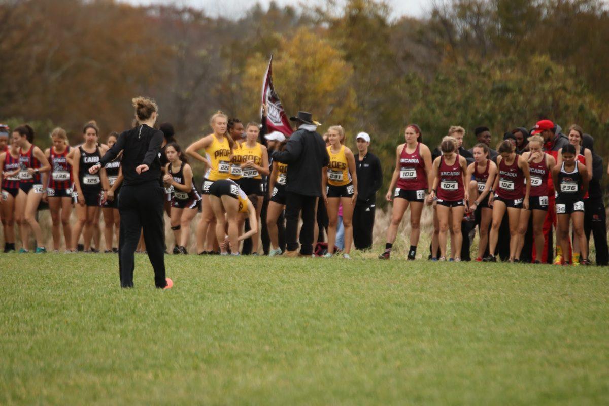 Coach Derick "Ringo" Adamson talks to his team before a meet. Coach Adamson shared his thoughts in Abby Churchill's strong start to her college career. Saturday, Nov. 13, 2021. - Multimedia Editor / Lee Kotzen