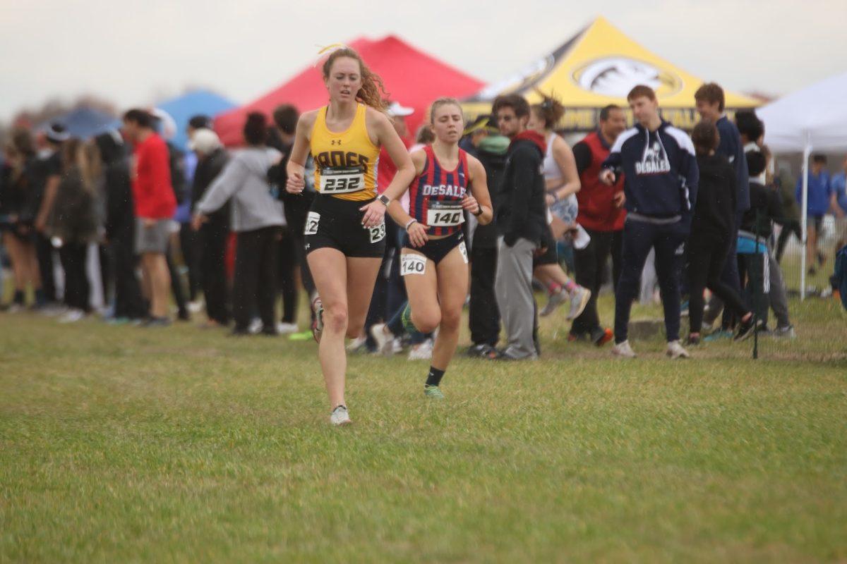 Cammy Wright finishes a race. Wright is one of the two captains for the women's cross country team. - Saturday, Nov. 13, 2021. - Multimedia Editor / Lee Kotzen