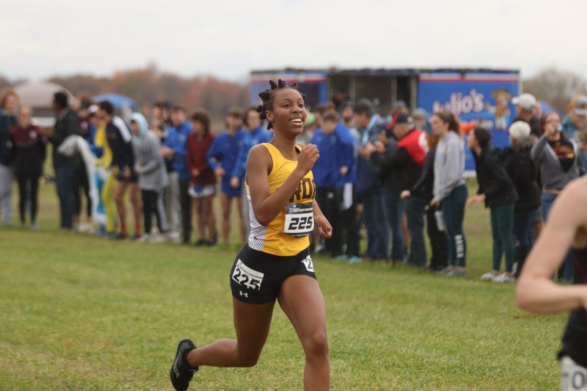 Sha'lynn Clarke crosses the finish line at a meet. Clarke has finished in the top 15 at the NJAC Championships every time she has competed. Saturday, Nov. 13, 2021. - Multimedia Editor / Lee Kotzen