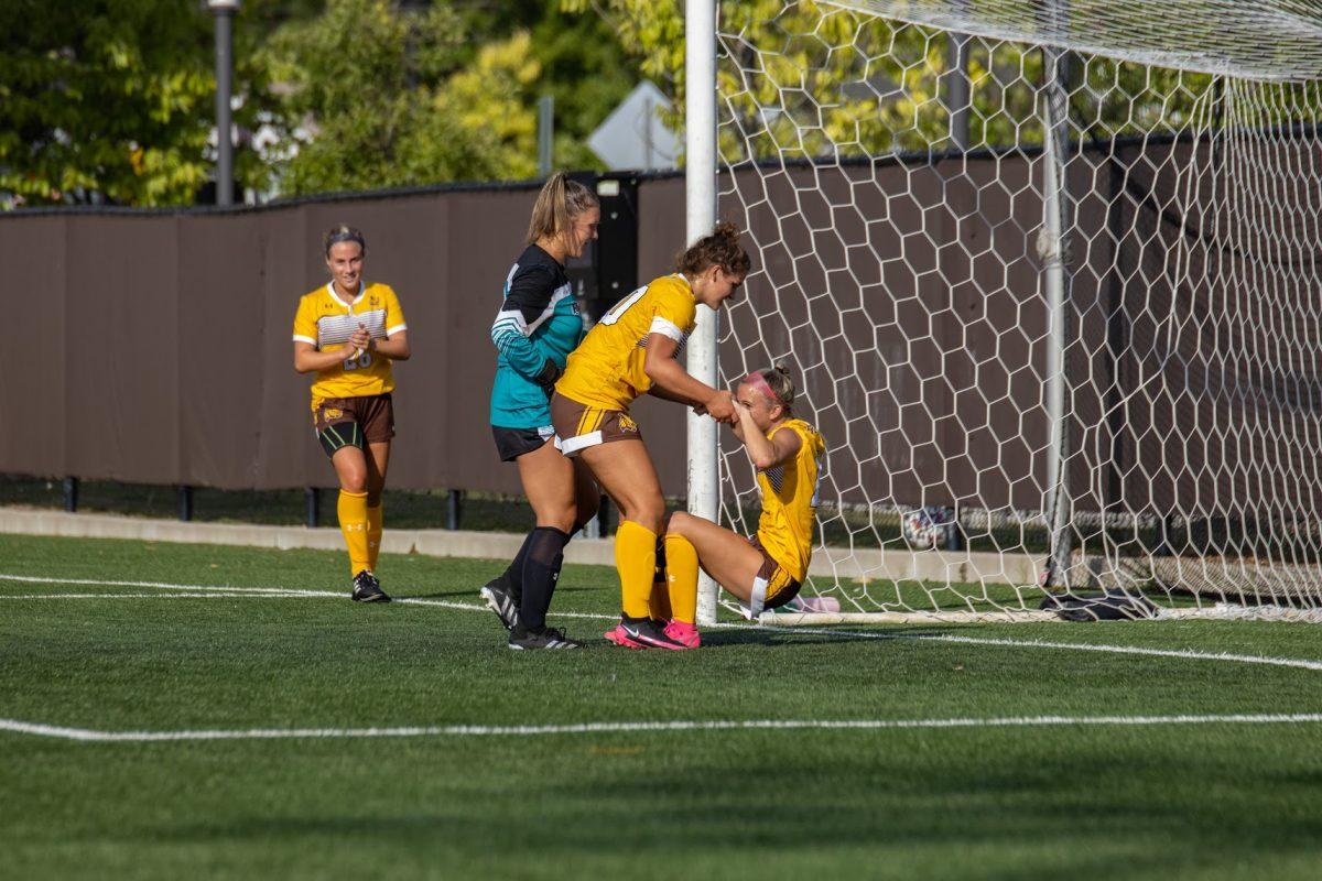 Emma DeMaise helps Julianna Giordano up after she made a goal-saving play. Giordano's stop prevented a Lynchburg victory as the game ended in a 1-1 draw. Friday, September 2, 2022. - Multimedia Editor / Lee Kotzen 