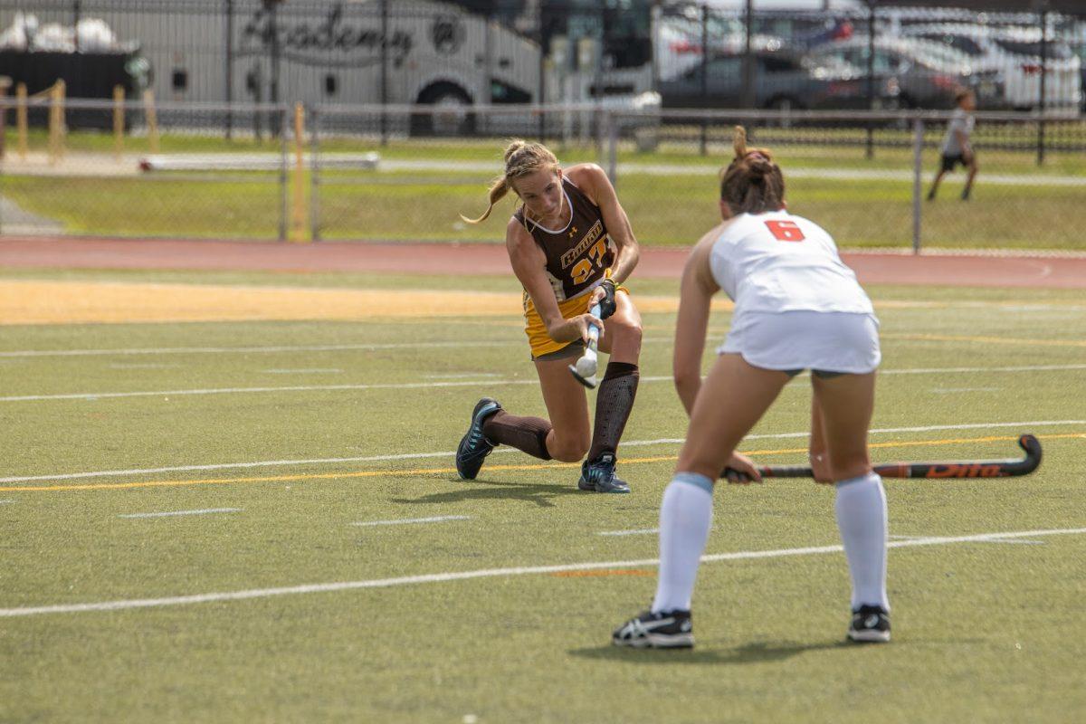 Julia Cavicchio scoops the ball. Cavicchio scored one of the eight goals on Saturday afternoon. Saturday, Sept. 3, 2022. - Multimedia Editor / Lee Kotzen